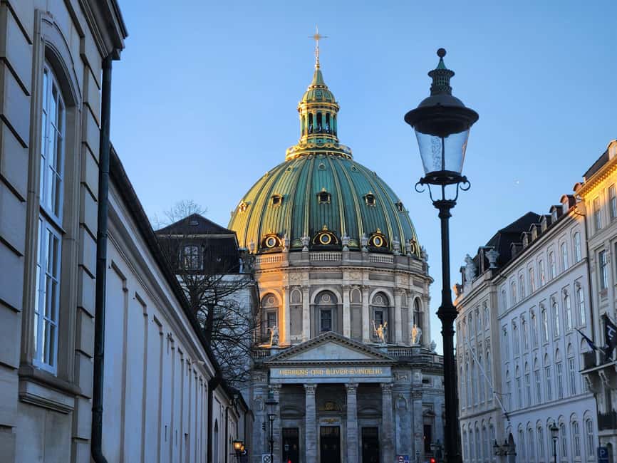 Copenhagen Combo: Walking Tour, Harbor Ferry & Royal Guards - Starting beneath Copenhagen Central Station’s famous clock