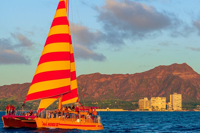 Honolulu Sunset Sail from Kewalo Harbor Including Drinks - The mood: more friendly party boat than silent sail